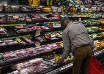 A customer shops for groceries in a supermarket in San Francisco.