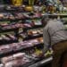 A customer shops for groceries in a supermarket in San Francisco.