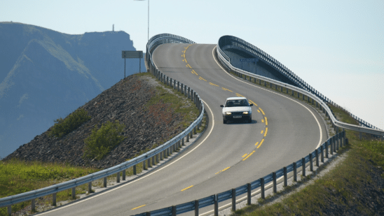 white car on windy road