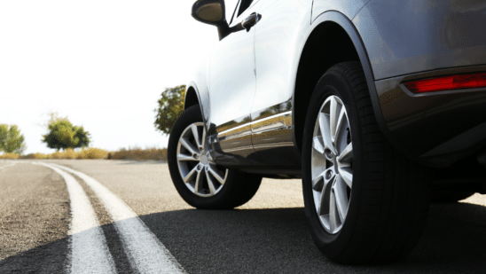 car on road close up on tires