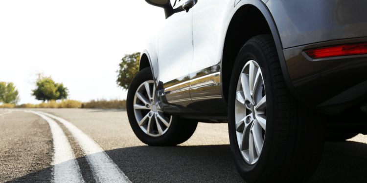 car on road close up on tires