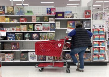 A customer looks at a display of board games in San Francisco. Photographer: Justin Sullivan/Getty Images