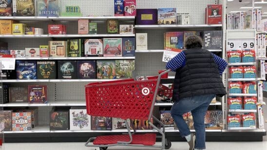 A customer looks at a display of board games in San Francisco. Photographer: Justin Sullivan/Getty Images