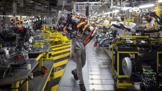 An employee uses a winch to mount the drive train system of a Renault Twingo Electric at the Renault Revoz d.d. plant in Novo Mesto, Slovenia. Photographer: Oliver Bunic/Bloomberg