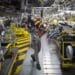 An employee uses a winch to mount the drive train system of a Renault Twingo Electric at the Renault Revoz d.d. plant in Novo Mesto, Slovenia. Photographer: Oliver Bunic/Bloomberg