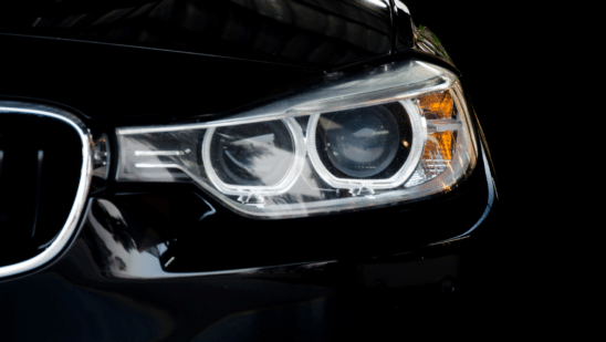 Close up of black car headlight