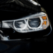 Close up of black car headlight