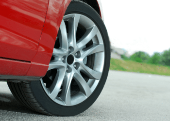 Closeup of a car tire on a red vehicle