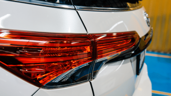 Close up of the headlight on a white SUV