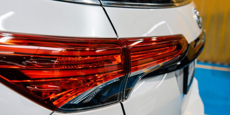 Close up of the headlight on a white SUV