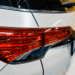 Close up of the headlight on a white SUV