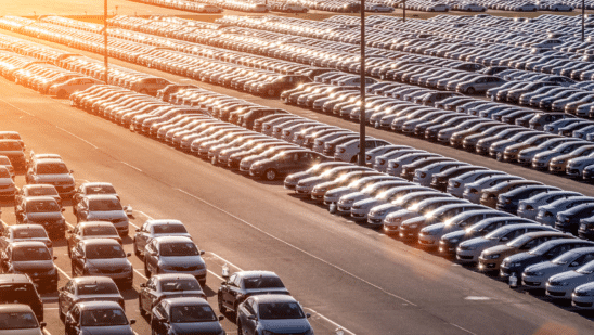 new cars parked at distribution center