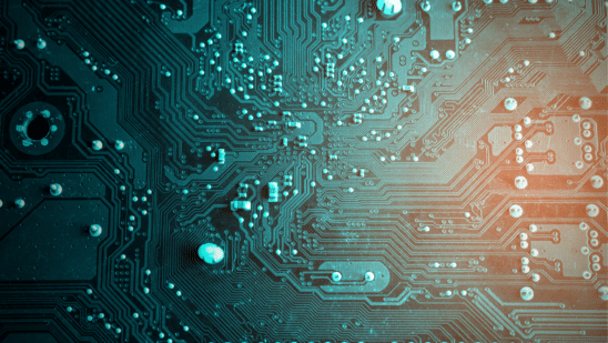 Photo of a circuit board in teal lighting