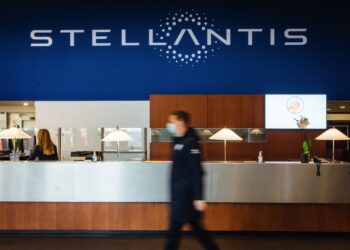 A Stellantis NV logo in the reception area of the automaker's technical center in Velizy-Villacoublay near Paris, France, on Monday, Jan. 18, 2021. Stellantis NV, the carmaker formed from the merger of Fiat Chrysler Automobiles NV and PSA Group, advanced in its first day of trading after completing a more than two-year effort to form one of the worlds largest vehicle manufacturers. Photographer: Cyril Marcilhacy/Bloomberg