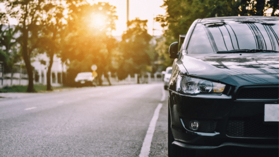 car on the side of the road at sunset