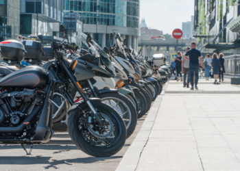 Motorcycles lined up along a curb