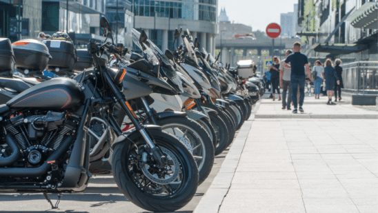 Motorcycles lined up along a curb