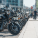 Motorcycles lined up along a curb