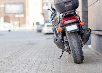 motorcycle sitting on the sidewalk