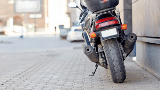 motorcycle sitting on the sidewalk