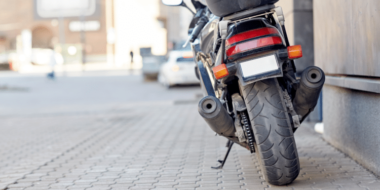 motorcycle sitting on the sidewalk