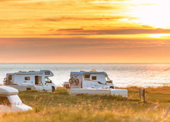 RVs on the water at sunset