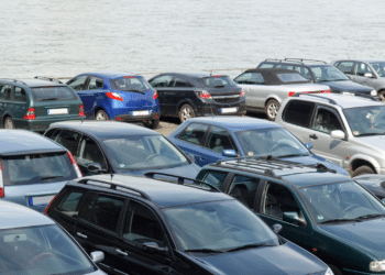 vehicles parked by ocean