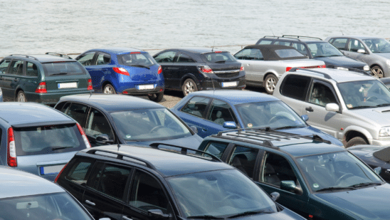 vehicles parked by ocean