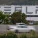 Vehicles pass the Tesla Inc. assembly plant in Fremont, California, U.S., on Monday, May 11, 2020. Elon Musk restarted production at Teslas only U.S. car plant, flouting county officials who ordered the company to stay closed and openly acknowledging he was risking arrest for himself and his employees.