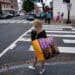 A shopper carries a bag in the Georgetown neighborhood of Washington, DC. Photographer: Al Drago/Bloomberg