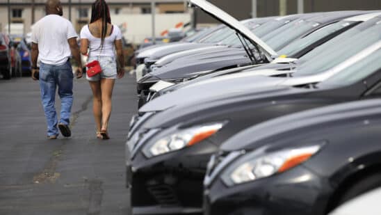 Customers shop for used vehicles at a dealership in Louisville, Kentucky.