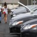 Customers shop for used vehicles at a dealership in Louisville, Kentucky.