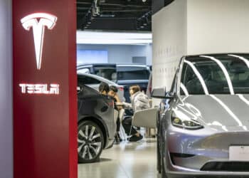 Customers inside a Tesla Inc. showroom in Shanghai, China, on Monday, April 29, 2024. Elon Musk's surprise visit to China appears to have paid immediate dividends, with Tesla clearing two key hurdles to introduce its driver-assistance system to the world's biggest auto market. Photographer: Qilai Shen/Bloomberg