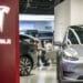Customers inside a Tesla Inc. showroom in Shanghai, China, on Monday, April 29, 2024. Elon Musk's surprise visit to China appears to have paid immediate dividends, with Tesla clearing two key hurdles to introduce its driver-assistance system to the world's biggest auto market. Photographer: Qilai Shen/Bloomberg