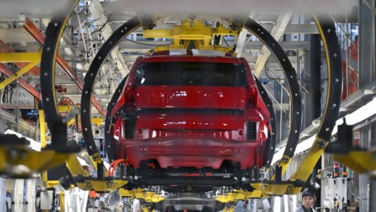 New Fiat Grande Panda EV model automobiles in cradles on the production line at the Stellantis NV manufacturing plant in Kragujevac, Serbia, on Monday, July 22, 2024. Fully electric and hybrid variants of the Grande Panda are planned for Serbian production. Photographer: Oliver Bunic/Bloomberg