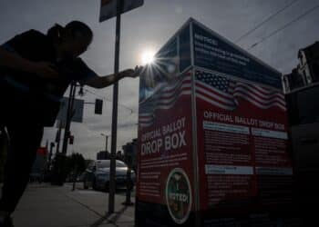 A voter submits their ballot at an official ballot drop box at a polling location for the 2024 Presidential election in San Francisco, California, US, on Tuesday, Nov. 5, 2024. The 2024 presidential campaign was marked by two assassination attempts, a candidate switch, divisive rhetoric and warnings about the fate of democracy. Photographer: David Paul Morris/Bloomberg