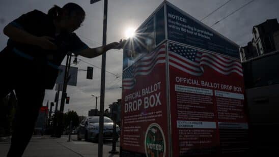 A voter submits their ballot at an official ballot drop box at a polling location for the 2024 Presidential election in San Francisco, California, US, on Tuesday, Nov. 5, 2024. The 2024 presidential campaign was marked by two assassination attempts, a candidate switch, divisive rhetoric and warnings about the fate of democracy. Photographer: David Paul Morris/Bloomberg
