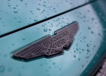 The front badge on an Aston Martin DBX sport utility vehicle (SUV) at the Aston Martin Lagonda Global Holdings Plc factory in St Athan, UK, on Thursday, March 23, 2023. Aston surged after the loss-making manufacturer said itll boost deliveries of lucrative models like the £190,000 ($229,349) DBX707 sport utility vehicle. Photographer: Chris Ratcliffe/Bloomberg