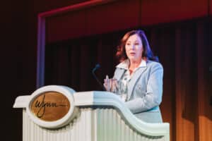 Susan Medrano of Synchrony accepts the performance award at PowerSports Finance Summit 2024. (Photo/Powersports Finance News) 