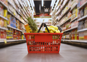 close up of groceries in basket on aisle