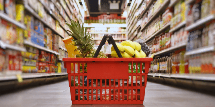 close up of groceries in basket on aisle