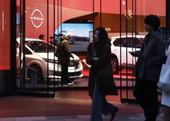 Vehicles displayed inside Nissan Motor Co.'s Ginza showroom in Tokyo, Japan, on Wednesday, Dec. 18, 2024. Nissan Motor Co. is in talks with fellow Japanese carmaker Honda Motor Co. to merge, in a deal that would help the ailing company survive, while also creating the world's third-largest automaker with a better chance of withstanding the industry's ructions. Photographer: Kiyoshi Ota/Bloomberg