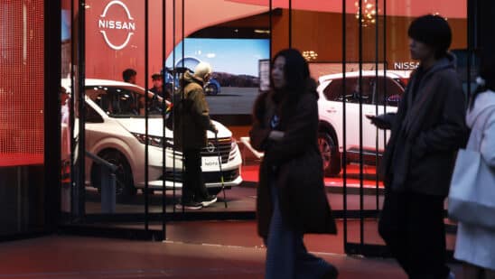 Vehicles displayed inside Nissan Motor Co.'s Ginza showroom in Tokyo, Japan, on Wednesday, Dec. 18, 2024. Nissan Motor Co. is in talks with fellow Japanese carmaker Honda Motor Co. to merge, in a deal that would help the ailing company survive, while also creating the world's third-largest automaker with a better chance of withstanding the industry's ructions. Photographer: Kiyoshi Ota/Bloomberg