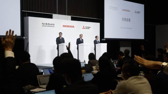 Nissan CEO Makoto Uchida, from left, Honda CEO Toshihiro Mibe and Mitsubishi CEO Takao Kato attend a news conference on Dec. 23. Photographer: Kiyoshi Ota/Bloomberg