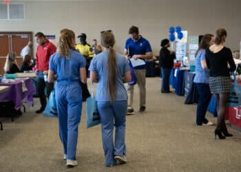 Attendees at a healthcare career fair in Wilmington, North Carolina. Jobless claims lower. Photographer: Allison Joyce/Bloomberg