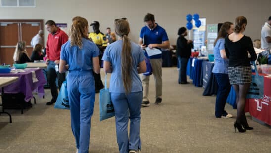 Attendees at a healthcare career fair in Wilmington, North Carolina. Jobless claims lower. Photographer: Allison Joyce/Bloomberg