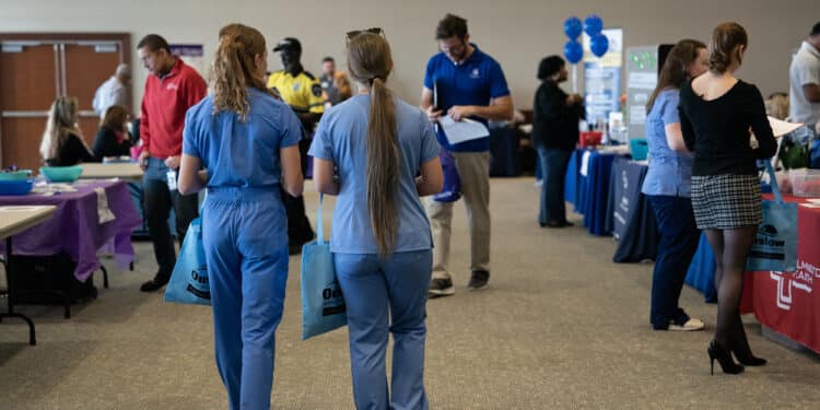 Attendees at a healthcare career fair in Wilmington, North Carolina. Jobless claims lower. Photographer: Allison Joyce/Bloomberg