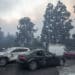 Damaged cars after being bulldozed out of the way to provide access for firefighters during the Palisades Fire in the Pacific Palisades neighborhood of Los Angeles, California, US, on Tuesday, Jan. 7, 2025. A fast-moving wildfire ripped through an affluent neighborhood in Los Angeles, forcing thousands of people to evacuate as the region braced for a brutal wind storm that could last well into the weekend. Photographer: Jill Connelly/Bloomberg