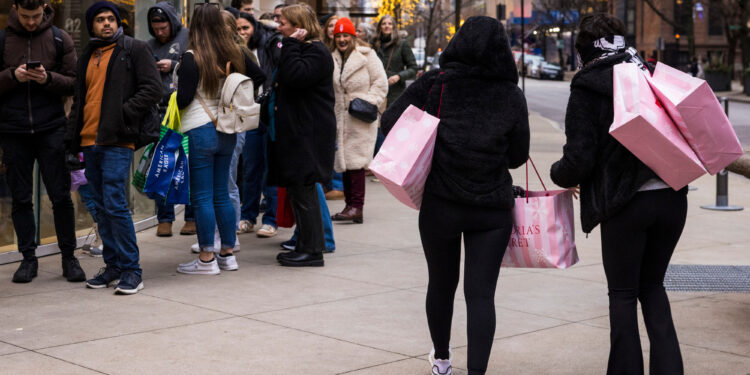 Shoppers carry bags in Chicago, Illinois.