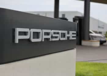 A sign at the Porsche AG first worldwide electric vehicle charging lounge in Bingen, Germany, on Monday, Aug. 28, 2023. The first Porsche Charging Lounge in the world is heated and air-conditioned by a heat pump that operates without fossil fuels, according to their press release. Photographer: Alex Kraus/Bloomberg